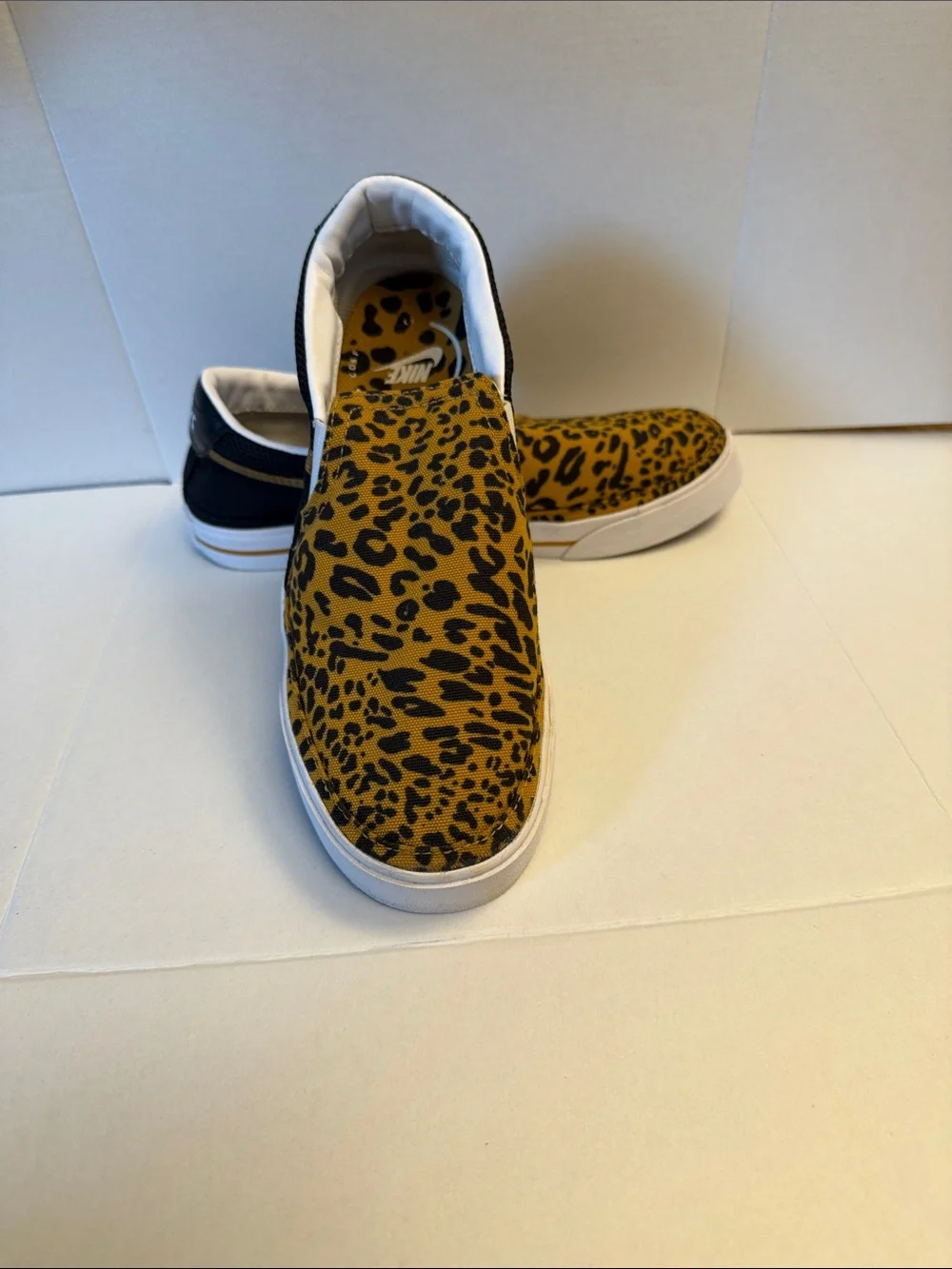 Nike Slip-On Sneakers in Black and Yellow Leopard Print